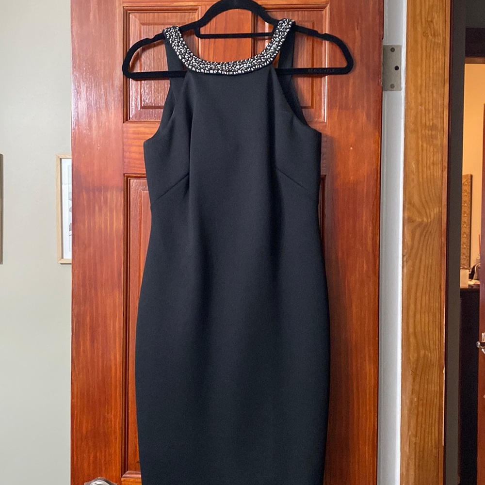 Size 4. Calvin Klein black dress with sequined around the neckline and straps